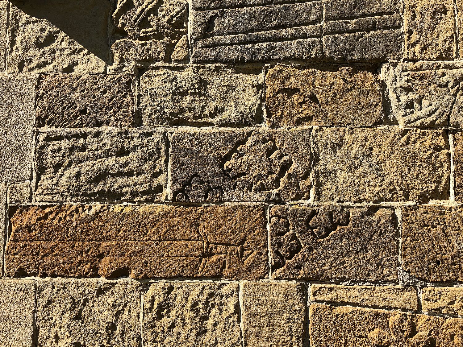 Stones and fragments from earlier Churches are incorporated in the walls